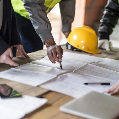 Housing projects - blueprint - finger pointing